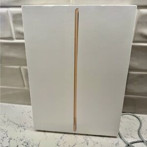 Apple 12.9” iPad Pro 128 GB (2nd Generation) Tablet in Gold comes with 2 cases.